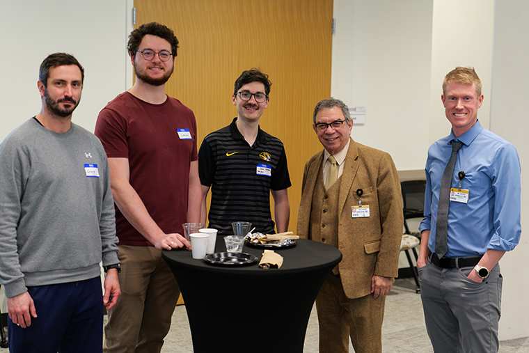 In this photo, I am visiting with postdoctoral trainees (from left to right) Georg Pietruschka, PhD; Leon Kraus, PhD; and Sam Hockett, PhD. Dr. Dave Arnold is standing to my right.