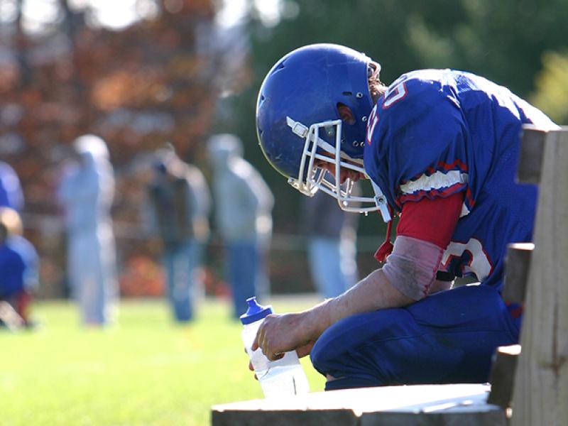 football player on the bench