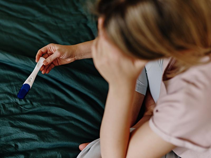 woman with pregnancy a test