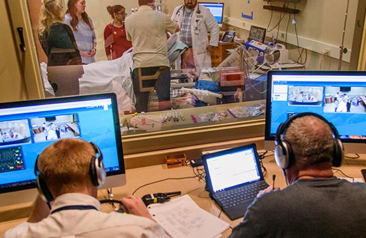 Photo of students in the Sim Center.